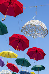 Umbrellas against blue sky 