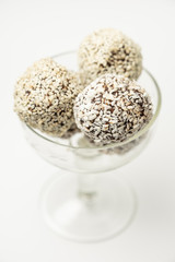 Various of round raw organic sweets with cacao chocolate and sesame. Homemade cooking