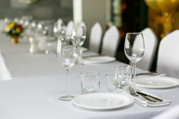 A close up view of restaurant table set with wine glasses