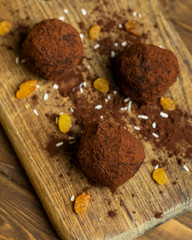 Various of round raw organic sweets with cacao chocolate and sesame. Homemade cooking