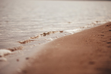 Fototapeta na wymiar waves on a sandy beach
