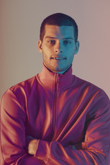 Obraz premium Studio close-up portrait of attractive male model. Color flash studio light