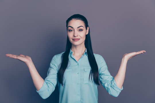 Photo of entrepreneur holding conference showing advantages disadvantages of different approaches wearing fromally isolated over grey color background holding objects with her hands