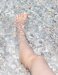 Feet of a girl sunbathing in the sun