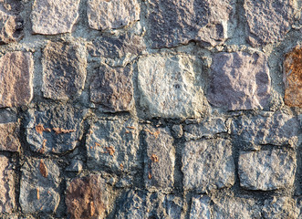Wall of stone blocks as an abstract background
