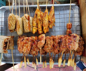 Epitome of Thai street food, grilled pork skewers