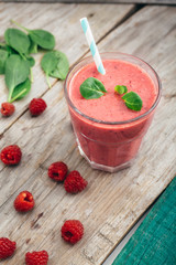healthy raspberry smoothie on wooden table