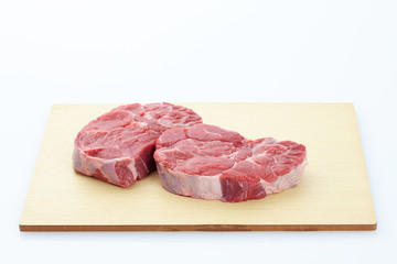 raw meat on a cutting board