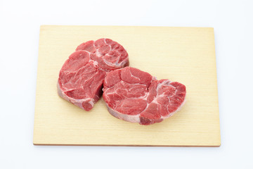raw meat on a cutting board