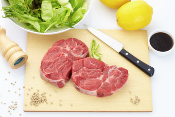 raw meat on a cutting board
