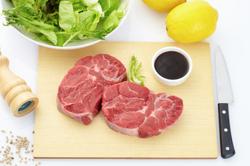 raw meat on a cutting board