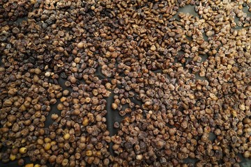 Dried date fruit rotates, background dates, close up. Food background. Organic food. Sunlights on many dates types . summer fruit 