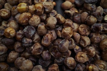 Dried date fruit rotates, background dates, close up. Food background. Organic food. Sunlights on many dates types . summer fruit 