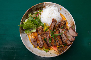 Peking duck curry with rice and salad