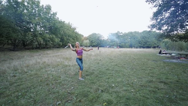 Pretty sporty fitness Girls emotionally Playing Badminton In Park. outdoor activity, picnic with friends, sport games, healthy lifestyle, slow motion fullHD stock footage.