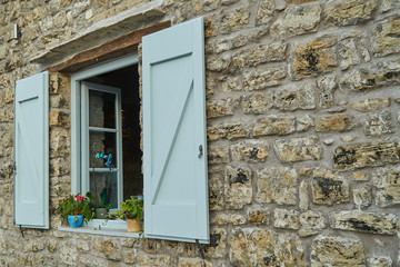 Cottage window with shutters