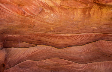 Background based on red sandstone texture. Photos of the walls of the canyon in the Sinai desert