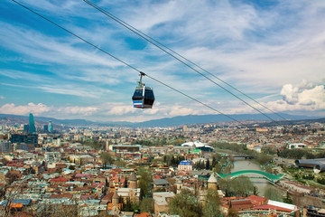 Beautiful landscape with sky, view from Mount Narikala to the city of Tbilisi with funiculars....