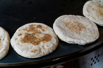 Baking pita bread, small fluffy breads. Also known as pide or bazlama.
