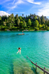 Fototapeta na wymiar Urisee - clear blue water of Laki Uri at Reutte in Tirol, Austria