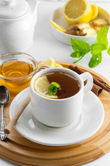 Cup tea with lemon and honey on a white background. Hot tea cup isolated, top view. Autumn, fall or winter drink. Copy space.
