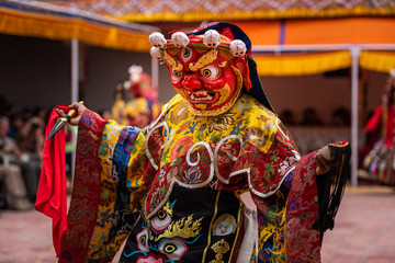 Monk performing a ritual dance in Takthok monastery, Ladakh