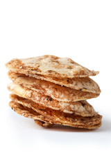 Brown rice chips isolated on white background. Healthy crispy snack