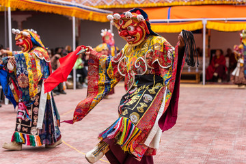 Monk performing a ritual dance in Takthok monastery, Ladakh