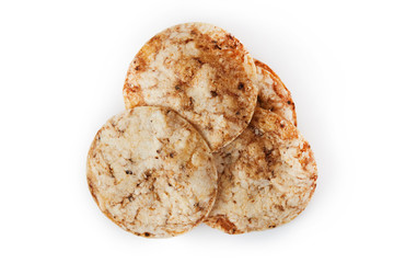 Brown rice chips isolated on white background. Healthy crispy snack