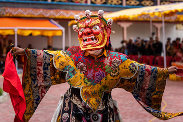 Monk performing a ritual dance in Takthok monastery, Ladakh - obrazy, fototapety, plakaty