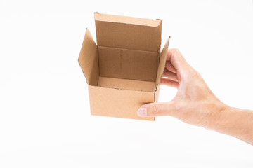 Man hand holding brown paper box on white background