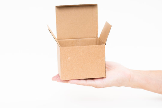 Man Hand Holding Brown Paper Box On White Background