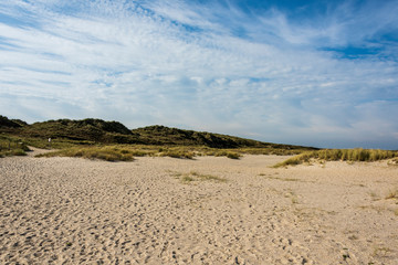 Beautiful tranquil dune landscape and long beach at North Sea