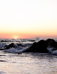 Beautiful sunset (sunrise) over the sea, beautiful waves.