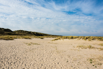 Beautiful tranquil dune landscape and long beach at North Sea