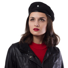 Young woman black jacket, red sweater and hat with a reference to Ernesto Che Guevara on a white...