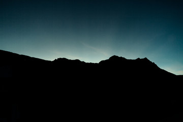 Silhouette of mountain range during sunset