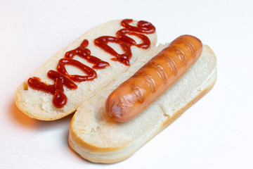 Hot dog bun with fried pork's sausage on white background. Text ketchup Hot-dog on bread. Top view. Close-up