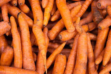 Pile of organic sweet carrots top view. Perfect for nutritious salad or healthy snack