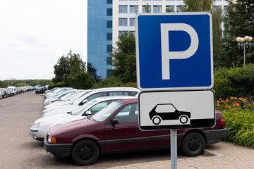 Car parking sign on square blue board, car parking with several cars
