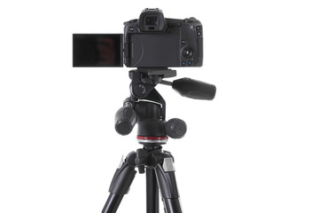 Backside view of modern multifunctional black camera on holder isolated