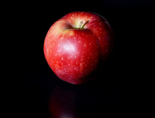an apple on black background