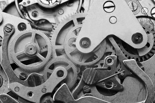 Clockwork, black-and-white gears in an watch. Teamwork concept, idea, technology, eternity, business. Macro. Design minimalism, Retro style