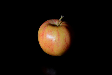 an apple on black background