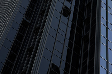Wall of black high modern glass building