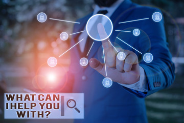 Text sign showing What Can I Help You With Question. Business photo text Offering assistance Experts advice ideas Male human wear formal work suit presenting presentation using smart device