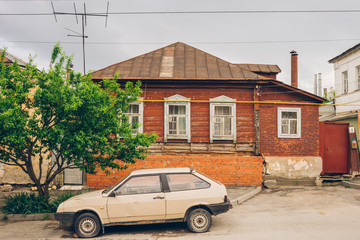 car in front of a house
