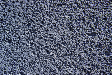 Image of a texture of a basaltic stone, volcanic rock
