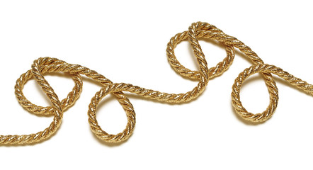 Golden rope with light shadow over white background