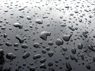 Drops on shiny metal floors for background